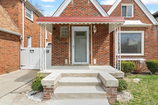 18696 Cherrylawn St, Detroit, MI 48221 - doorway to property with brick siding and a gate