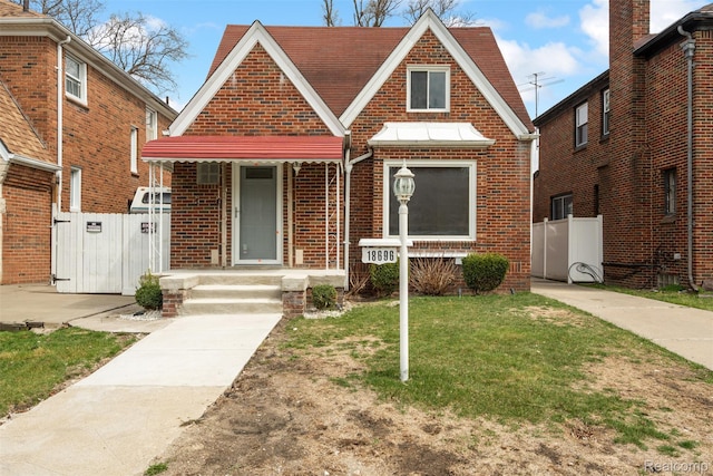 18696 Cherrylawn St, Detroit, MI 48221 - tudor home featuring brick siding and a gate