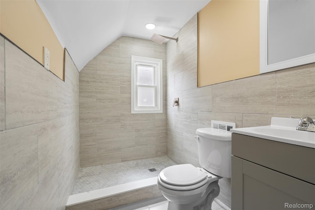 18696 Cherrylawn St, Detroit, MI 48221 - full bath with a tile shower, vanity, lofted ceiling, toilet, and tile walls