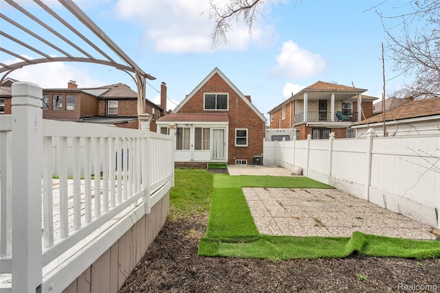 18696 Cherrylawn St, Detroit, MI 48221 - back of house with brick siding and a patio