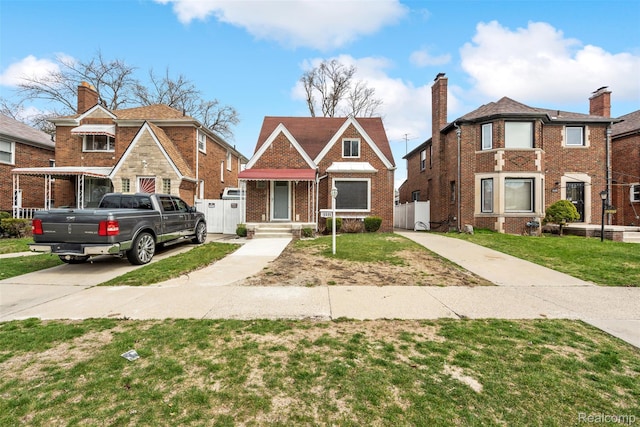 18696 Cherrylawn St, Detroit, MI 48221 - english style home with brick siding, concrete driveway, and a chimney