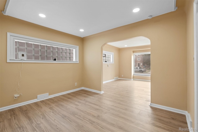 18696 Cherrylawn St, Detroit, MI 48221 - spare room with arched walkways, wood finished floors, baseboards, and recessed lighting