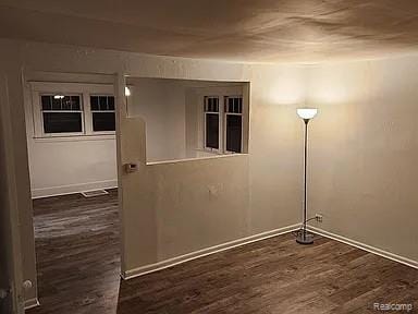 513 W Kilborn St, Lansing, MI 48906 - unfurnished room featuring wood finished floors and baseboards