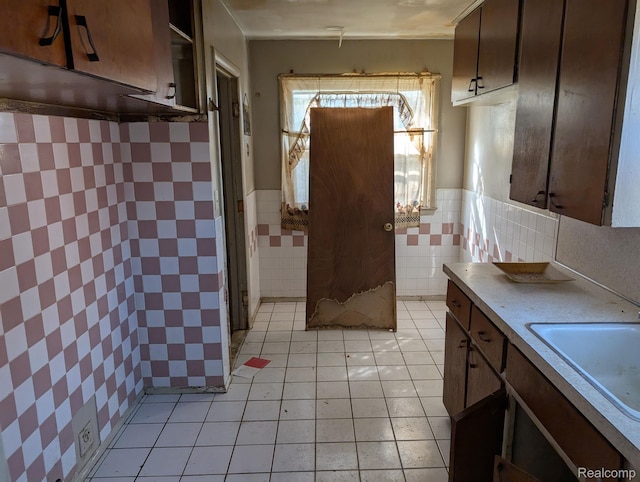 17224 Waveney St, Detroit, MI 48224 - bathroom featuring tile walls, tile patterned flooring, vanity, and wainscoting
