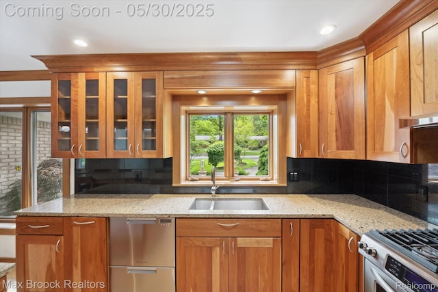 4335 Queens Way, Bloomfield Hills, MI 48304 - kitchen featuring a sink, stainless steel appliances, decorative backsplash, light stone countertops, and recessed lighting