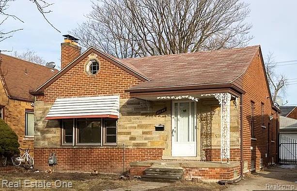 17190 Ilene St, Dearborn Heights, MI 48221 - view of front of home featuring a chimney, brick siding, and a shingled roof