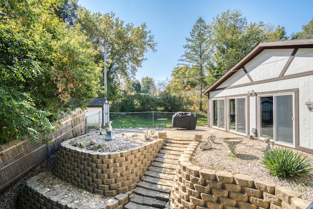 610 Birch St, Big Rapids, MI 49307 - fenced backyard featuring a patio