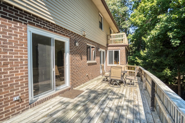 610 Birch St, Big Rapids, MI 49307 - wooden deck featuring outdoor dining space