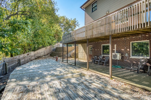 610 Birch St, Big Rapids, MI 49307 - wooden deck with a fenced backyard, a cooling unit, and a patio