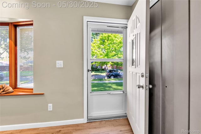32601 Grinsell Dr, Warren, MI 48092 - doorway to outside with wood finished floors and baseboards