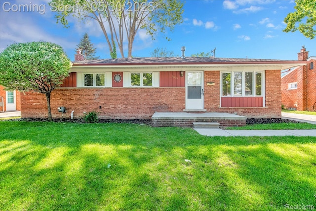 32601 Grinsell Dr, Warren, MI 48092 - single story home featuring brick siding, a front yard, a chimney, and board and batten siding