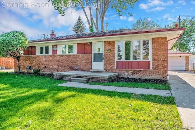 32601 Grinsell Dr, Warren, MI 48092 - single story home featuring brick siding, a front yard, and board and batten siding