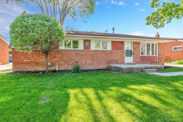 32601 Grinsell Dr, Warren, MI 48092 - ranch-style house featuring a front yard and brick siding