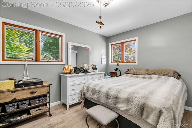 32601 Grinsell Dr, Warren, MI 48092 - bedroom with light wood-type flooring and baseboards