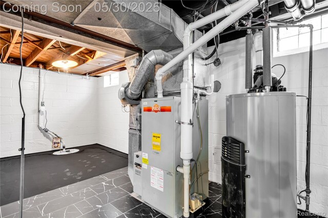 32601 Grinsell Dr, Warren, MI 48092 - below grade area featuring gas water heater and marble finish floors