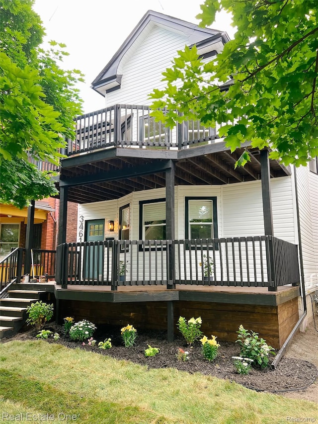 3461 Sheridan St, Detroit, MI 48214 - rear view of house featuring a balcony and a porch