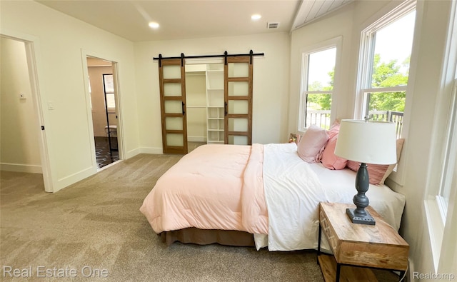3461 Sheridan St, Detroit, MI 48214 - bedroom featuring a barn door, carpet flooring, baseboards, and recessed lighting