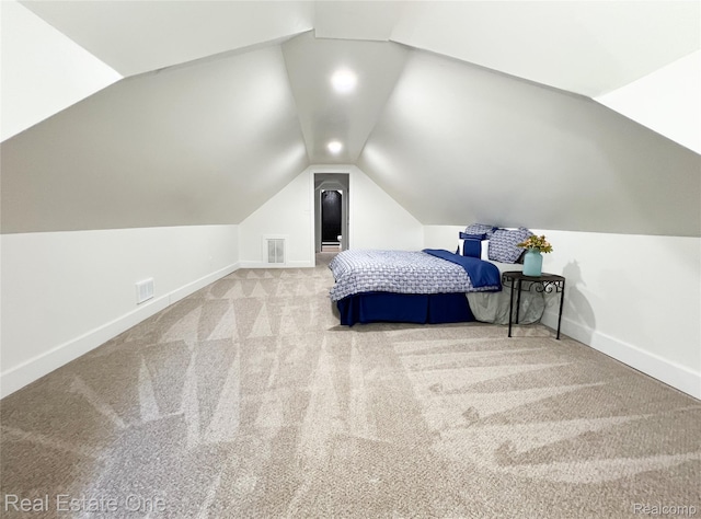 3461 Sheridan St, Detroit, MI 48214 - carpeted bedroom with lofted ceiling and baseboards