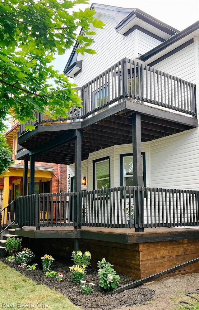 3461 Sheridan St, Detroit, MI 48214 - back of house featuring a balcony and covered porch