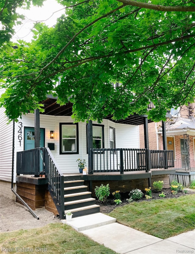 3461 Sheridan St, Detroit, MI 48214 - view of property hidden behind natural elements featuring a porch