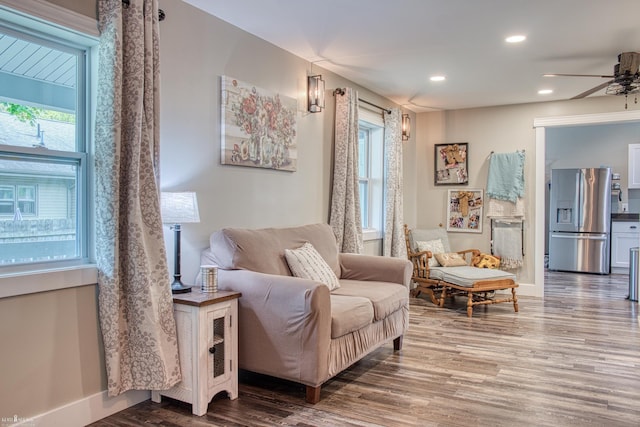 703 W Main St, Durand, MI 48429 - sitting room with wood finished floors, healthy amount of natural light, ceiling fan, baseboards, and recessed lighting