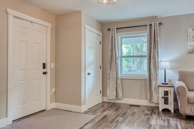 703 W Main St, Durand, MI 48429 - foyer with wood finished floors and baseboards