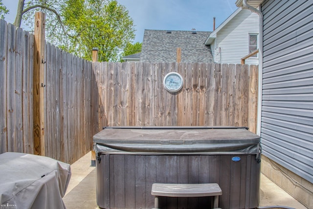 703 W Main St, Durand, MI 48429 - view of patio featuring a hot tub