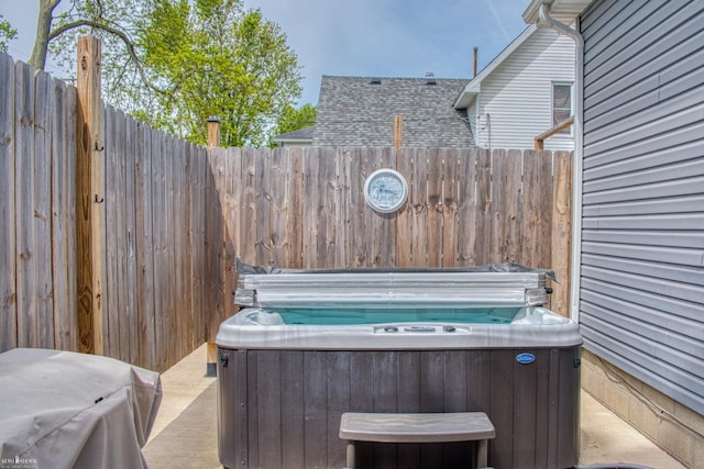 703 W Main St, Durand, MI 48429 - view of patio / terrace with a hot tub