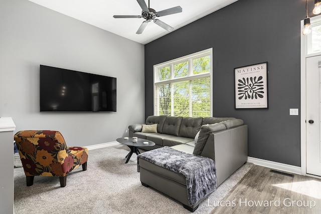 301 NW Xing Unit 25, Holland, MI 49423 - living room with healthy amount of natural light, ceiling fan, baseboards, and wood finished floors
