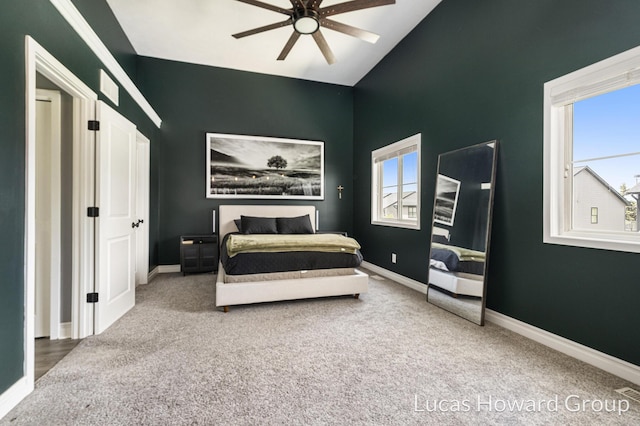 301 NW Xing Unit 25, Holland, MI 49423 - carpeted bedroom featuring baseboards, high vaulted ceiling, and a ceiling fan