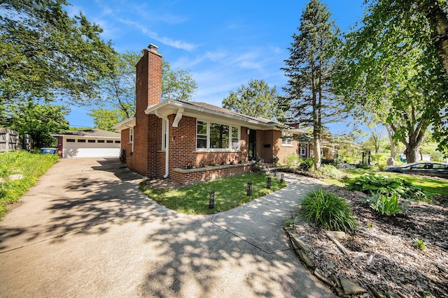 1537 Marian Ave, Ann Arbor, MI 48103 - view of front of house featuring brick siding, a chimney, and an outbuilding