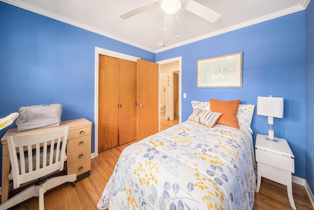 1537 Marian Ave, Ann Arbor, MI 48103 - bedroom featuring light wood-style floors, a closet, ornamental molding, baseboards, and a ceiling fan