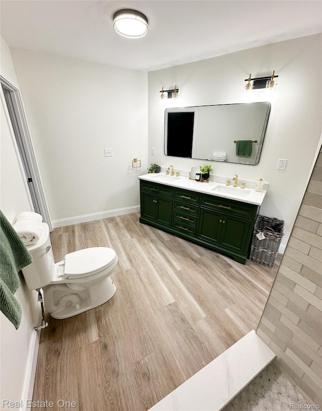 3504 Townsend St, Detroit, MI 48214 - bathroom with wood finished floors, double vanity, toilet, and baseboards