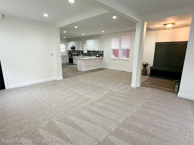 3504 Townsend St, Detroit, MI 48214 - unfurnished living room with recessed lighting, light carpet, and baseboards
