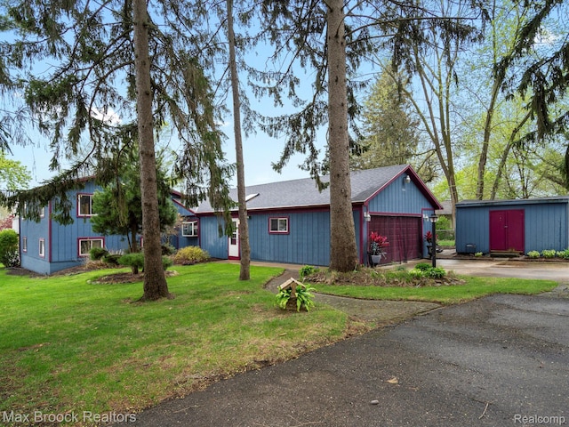 9431 Mandon Rd, White Lake, MI 48386 - view of front of property featuring concrete driveway, a front yard, an attached garage, and roof with shingles