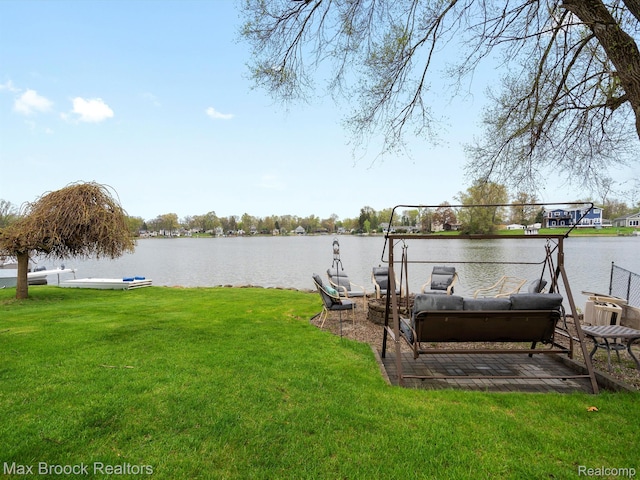 9431 Mandon Rd, White Lake, MI 48386 - view of grassy yard featuring a water view and a dock