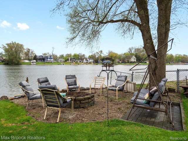 9431 Mandon Rd, White Lake, MI 48386 - view of yard with a fire pit and a water view