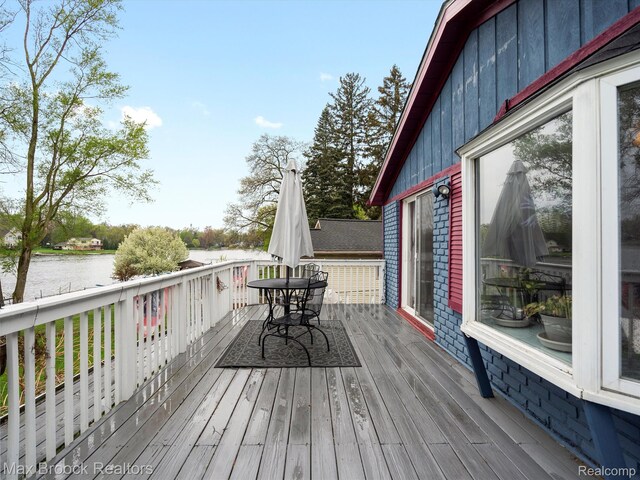9431 Mandon Rd, White Lake, MI 48386 - wooden deck with a water view