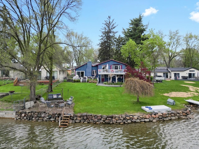 9431 Mandon Rd, White Lake, MI 48386 - dock area featuring a fire pit, a deck with water view, and a yard