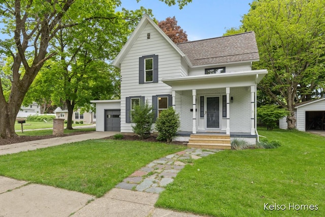 510 Division St, Big Rapids, MI 49307 - view of front of property featuring concrete driveway, roof with shingles, a front lawn, covered porch, and an attached garage