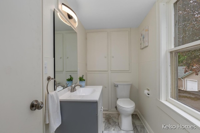 510 Division St, Big Rapids, MI 49307 - bathroom featuring vanity and toilet