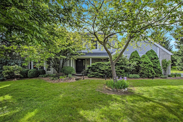 1336 Coventry Square Dr, Ann Arbor, MI 48103 - view of property hidden behind natural elements with a front lawn
