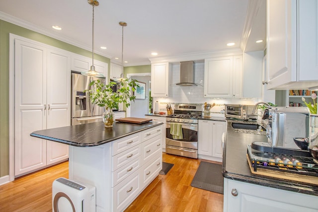 1336 Coventry Square Dr, Ann Arbor, MI 48103 - kitchen featuring wall chimney range hood, stainless steel appliances, dark countertops, crown molding, and white cabinetry