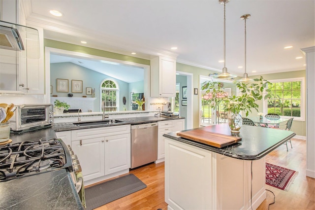 1336 Coventry Square Dr, Ann Arbor, MI 48103 - kitchen with dishwasher, a sink, dark countertops, a center island, and backsplash