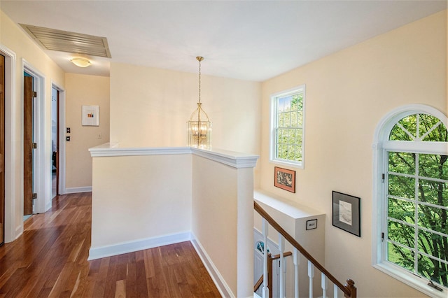 1336 Coventry Square Dr, Ann Arbor, MI 48103 - corridor featuring an upstairs landing, dark wood finished floors, a chandelier, and baseboards