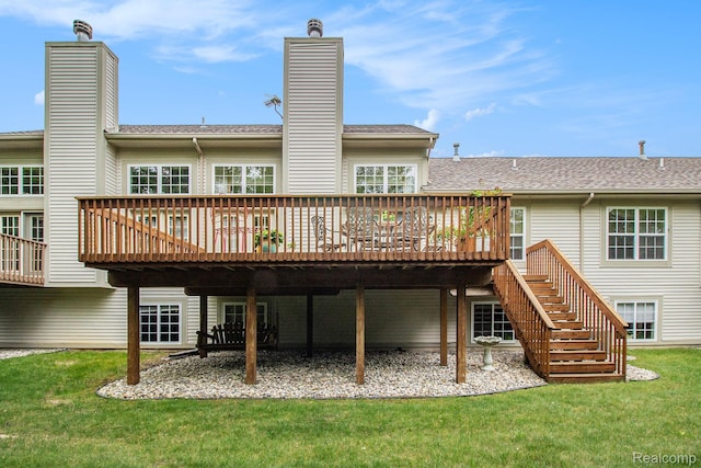 5886 Augusta Ln, Grand Blanc, MI 48439 - back of property with a deck, a chimney, a lawn, and a shingled roof