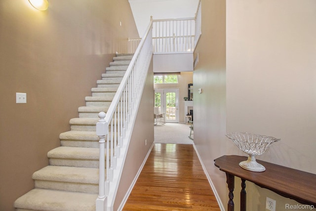 5886 Augusta Ln, Grand Blanc, MI 48439 - stairway with baseboards, wood finished floors, and a high ceiling