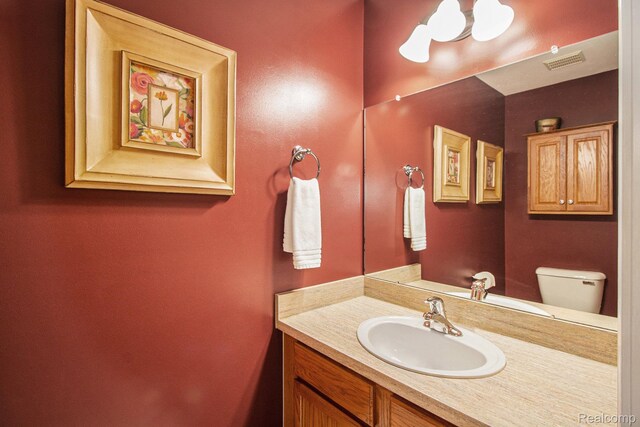 5886 Augusta Ln, Grand Blanc, MI 48439 - bathroom featuring vanity and toilet