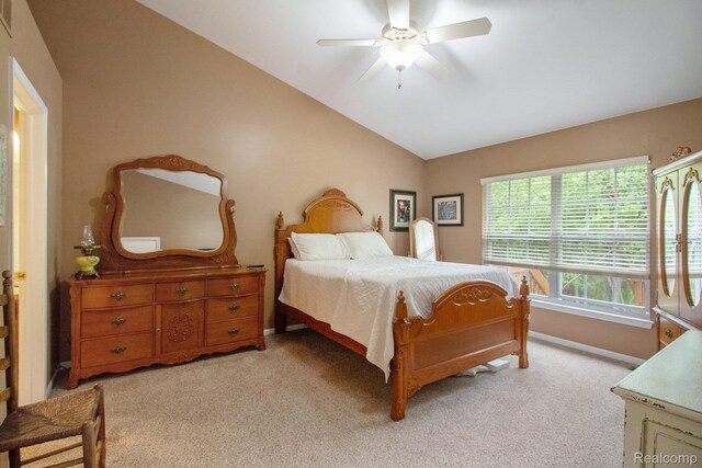 5886 Augusta Ln, Grand Blanc, MI 48439 - bedroom with lofted ceiling, light carpet, baseboards, and a ceiling fan