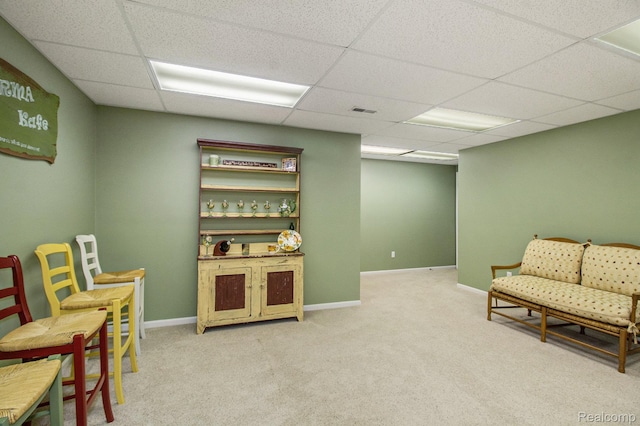 5886 Augusta Ln, Grand Blanc, MI 48439 - living area with a paneled ceiling, carpet floors, and baseboards